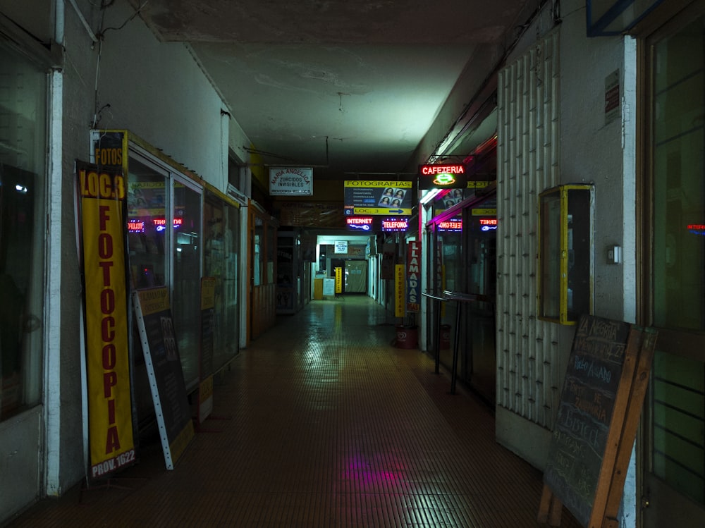 a long hallway with a lot of signs on the walls