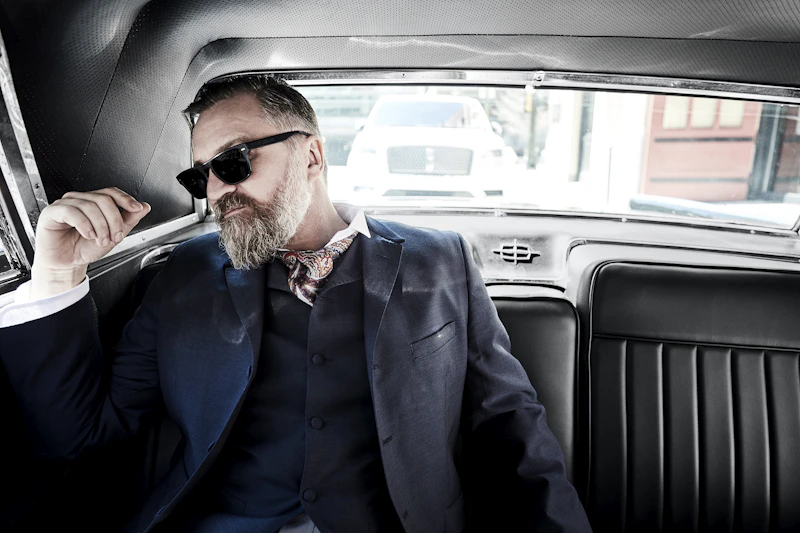 Man in sunglasses inside a vehicle