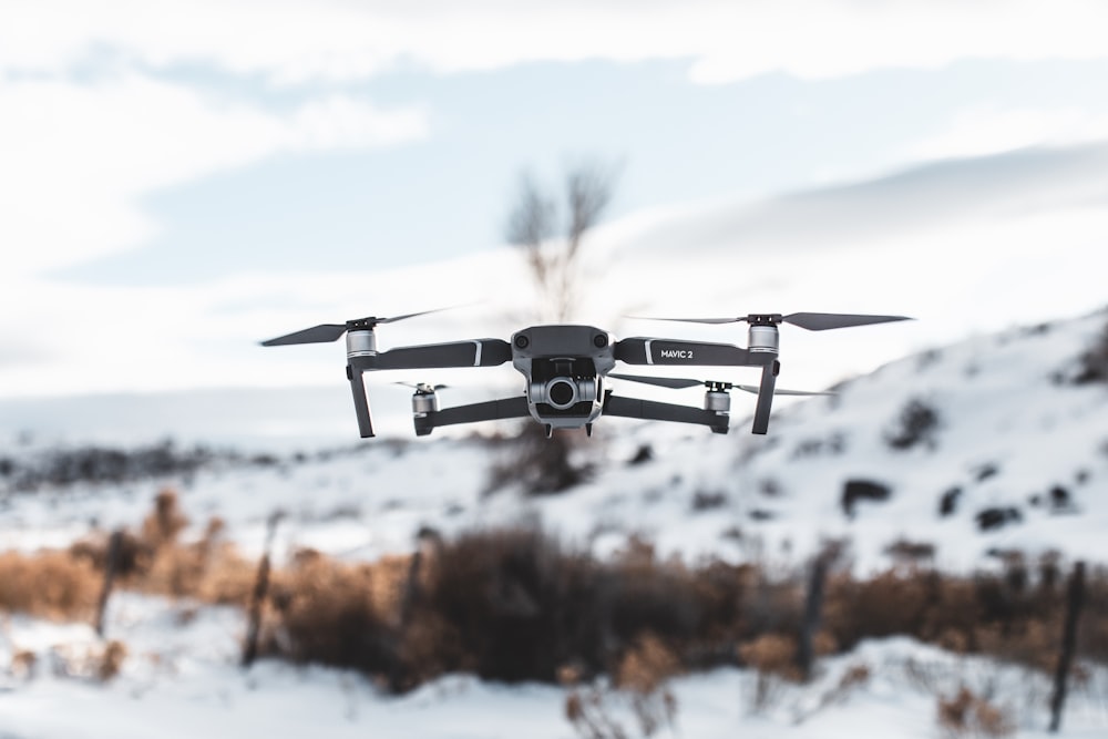 flying black and white drone