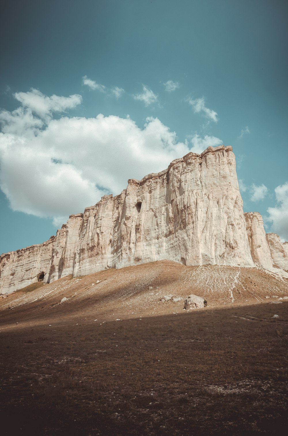 rock mountain under blue sky