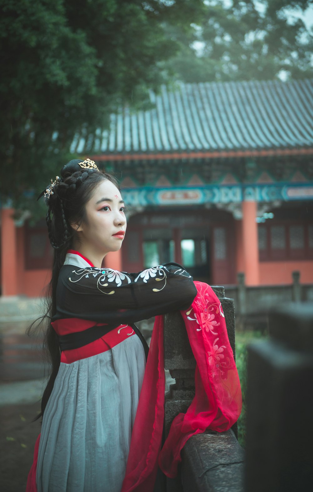 woman wearing teal and black traditional dress