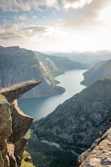 photo of mountain and ocean scenery