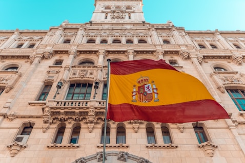 flag on pole beside building during day