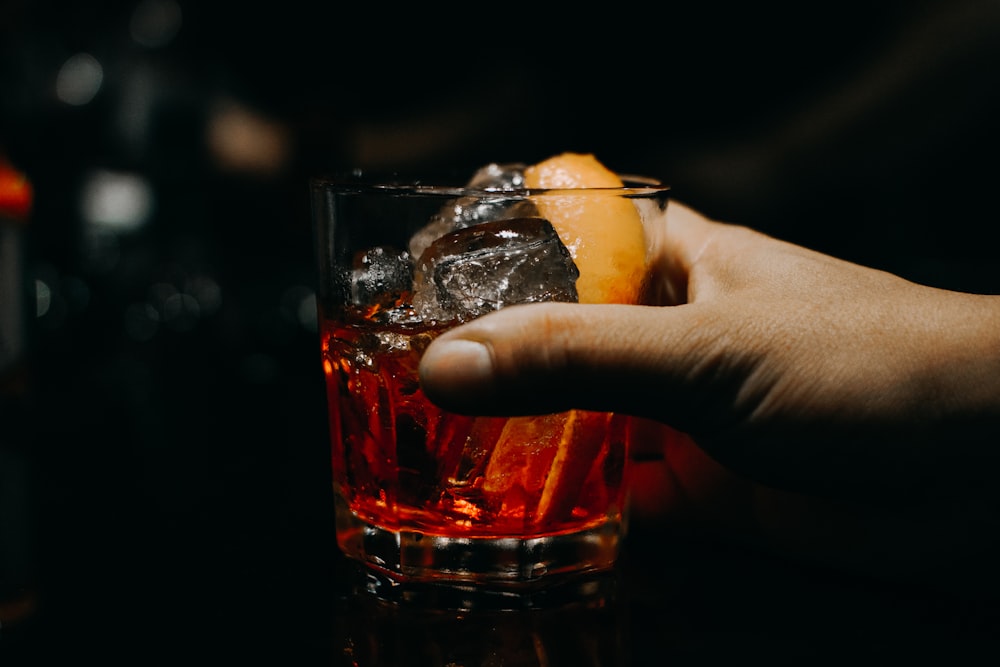 near full clear drinking glass with ice