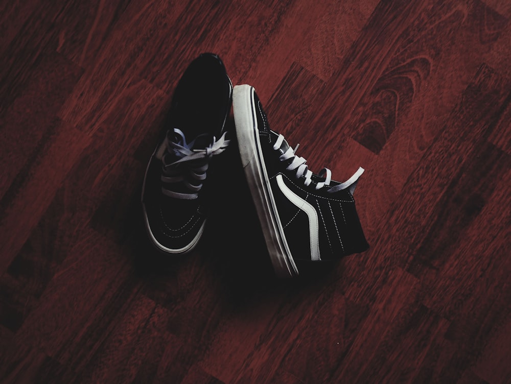 pair of black Vans high