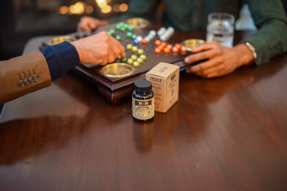 labeled bottle on wooden table