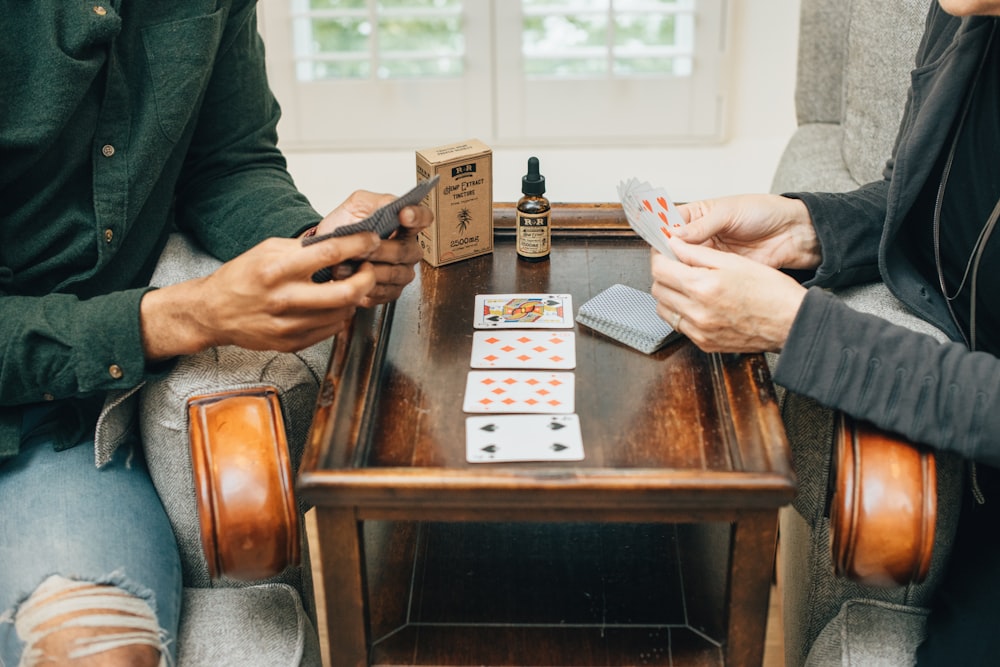 two person playing playing cards