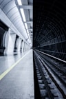 grayscale photography of train station with no people