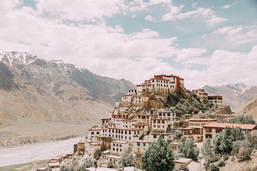 white concrete houses near mountain