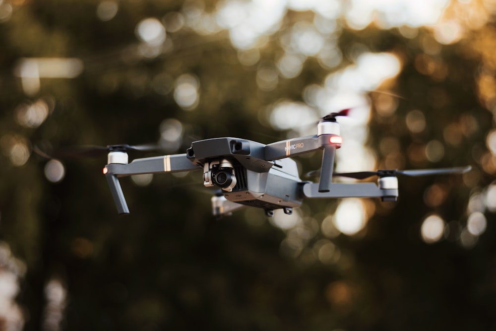 selective focus photography of gray drone