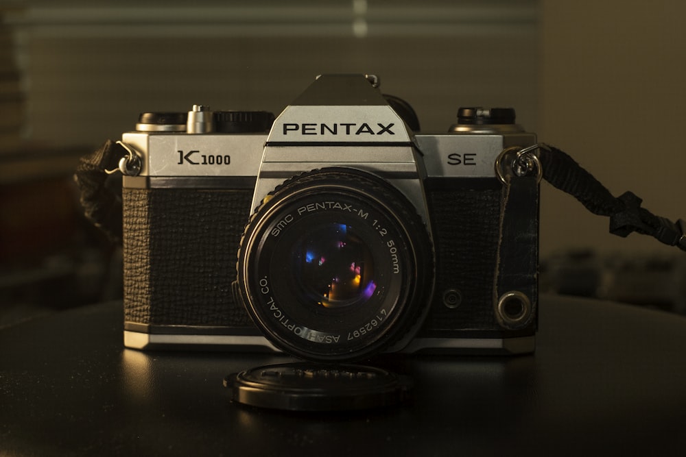 black and grey Pentax camera