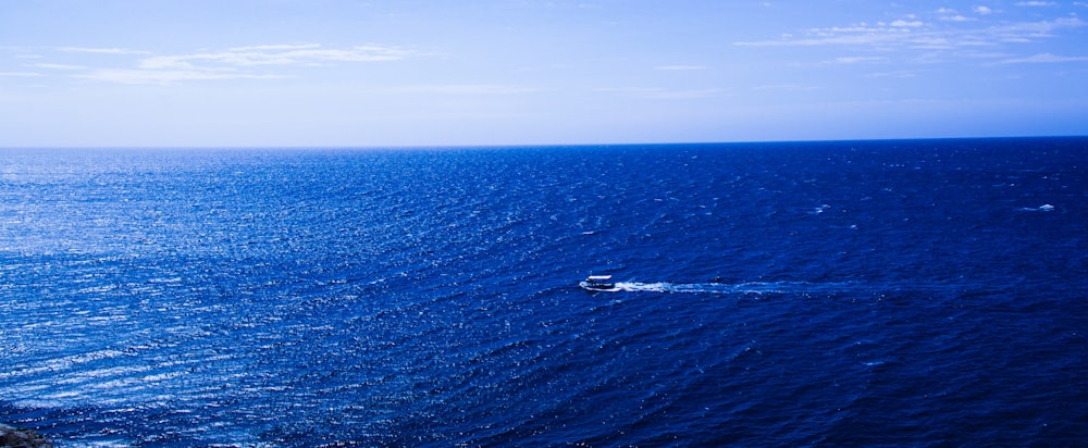 calm sea under clear blue sky