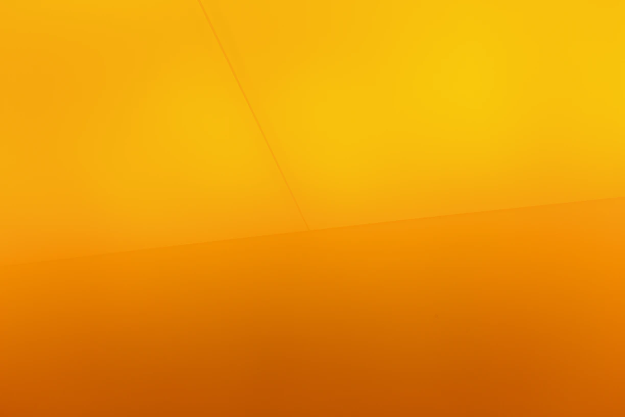 a yellow wall with a clock on it