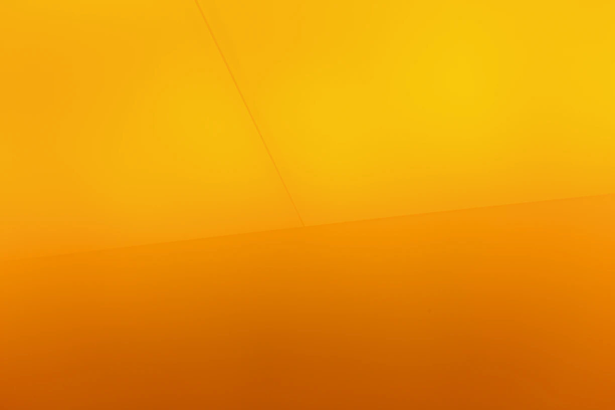 a yellow wall with a clock on it