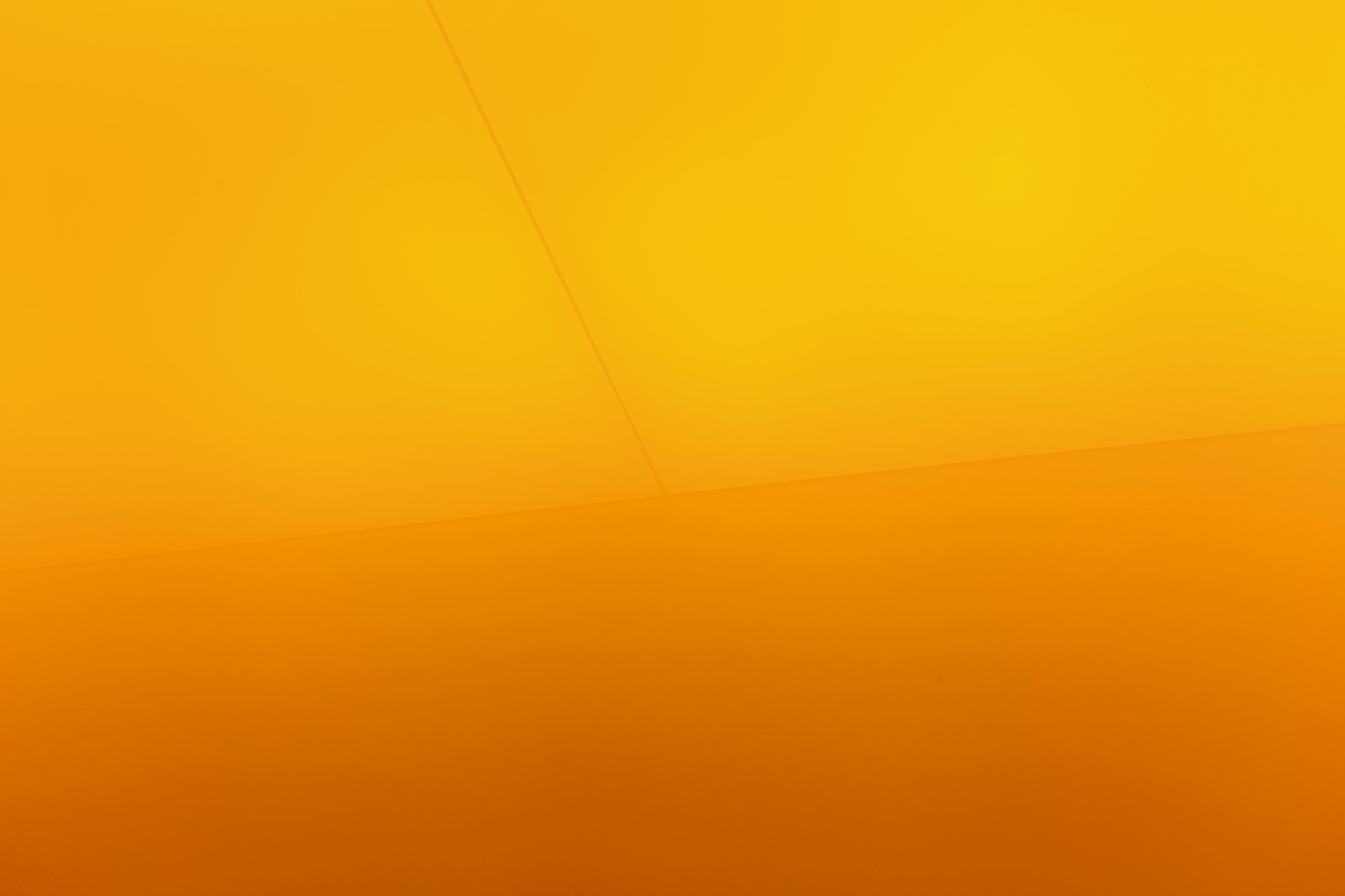 a yellow wall with a clock on it