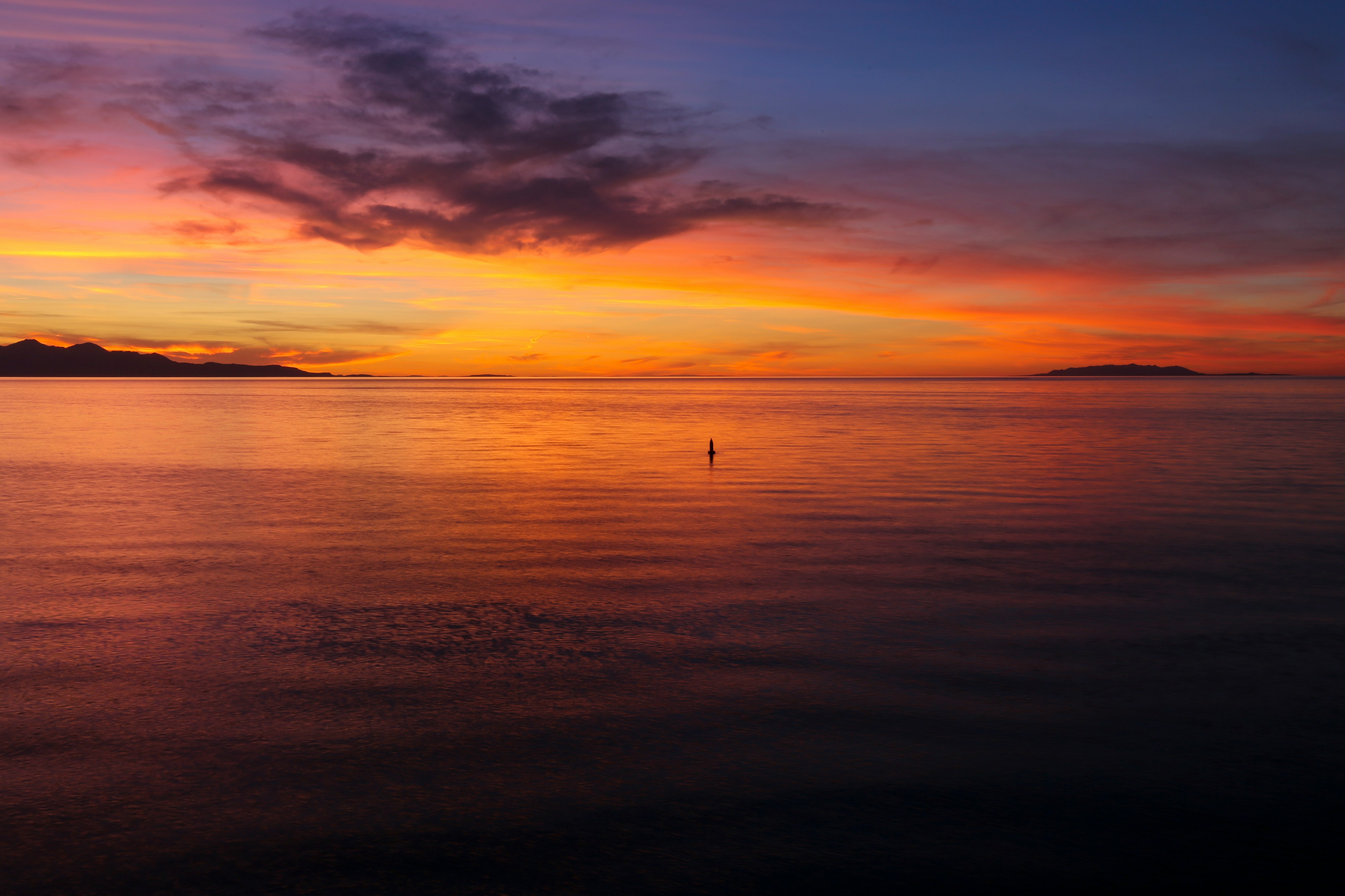 body of water during golden hour