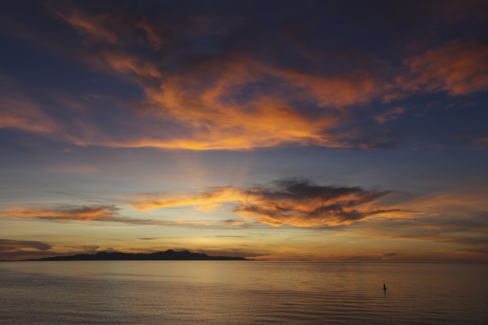 body of water during golden hour