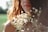woman wears white flower