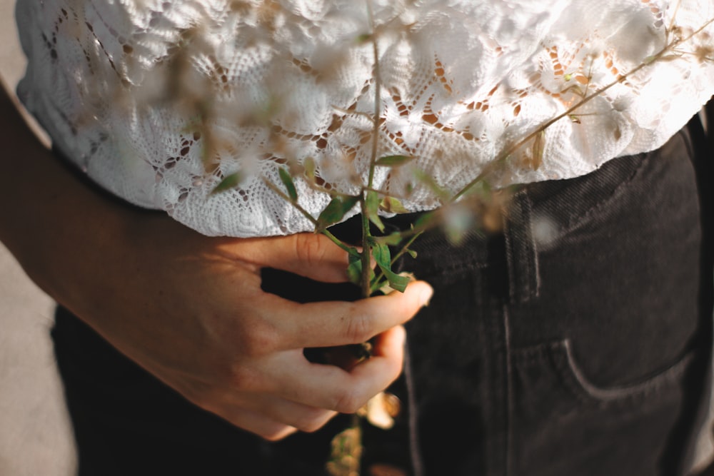 person holding flower