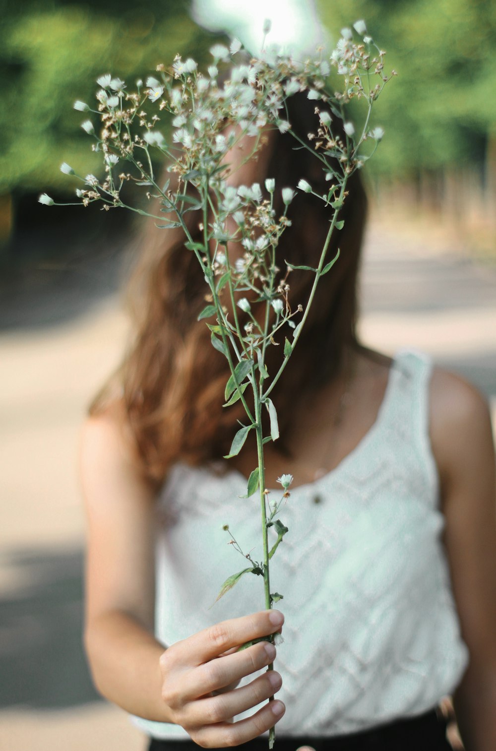 woman hold white flower