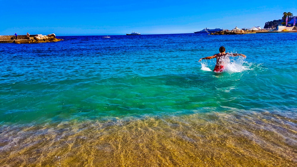 person on body of water at daytime