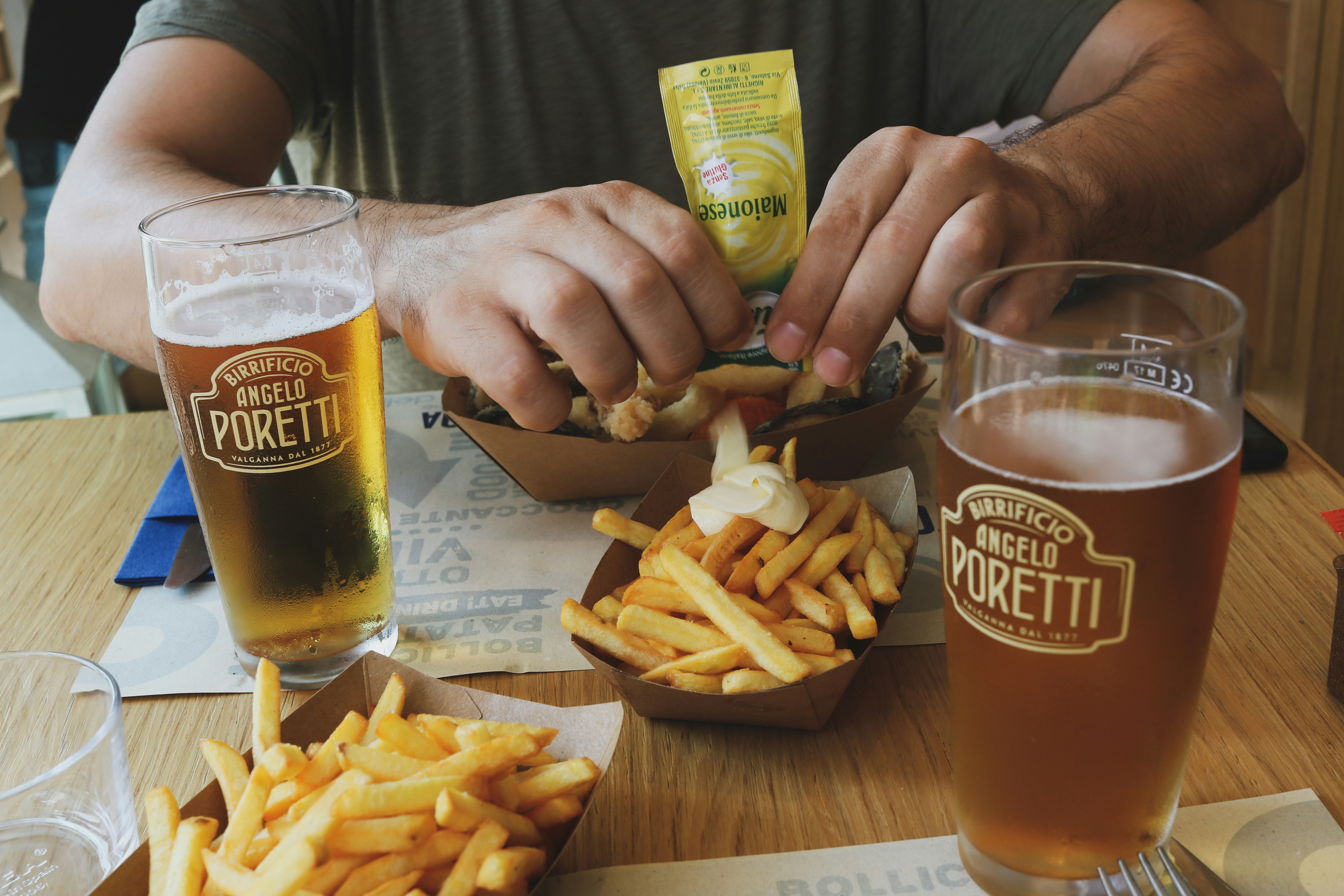 person eating fries