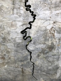 Waterjet slicing through a colorful stone slab, showcasing smooth edges.