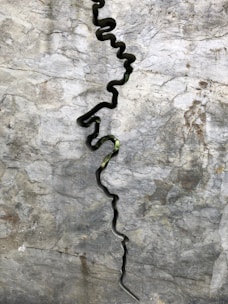 Waterjet slicing through a colorful stone slab, showcasing smooth edges.