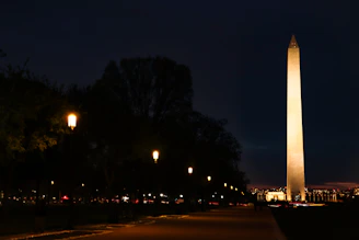 A nighttime view of the monument illuminated by soft lighting.