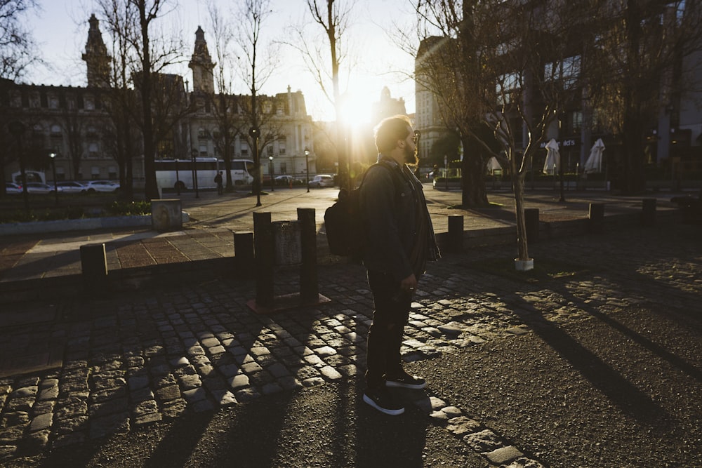 man carrying backpack