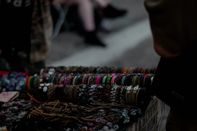 Sophisticated bracelets arranged artistically on a dark wooden table.