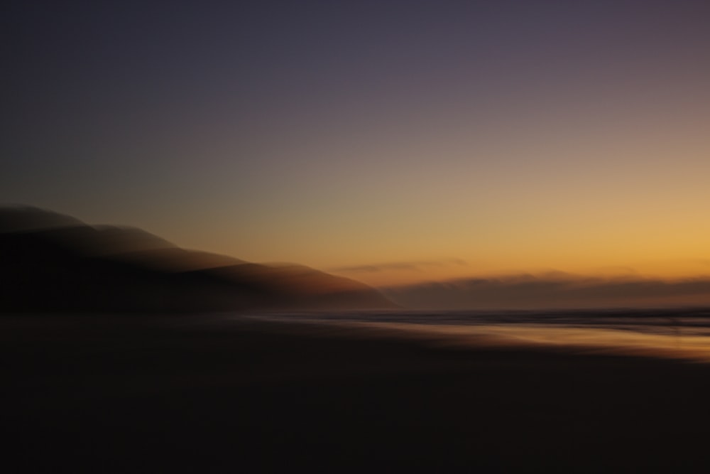 silhouette of mountain during golden hour