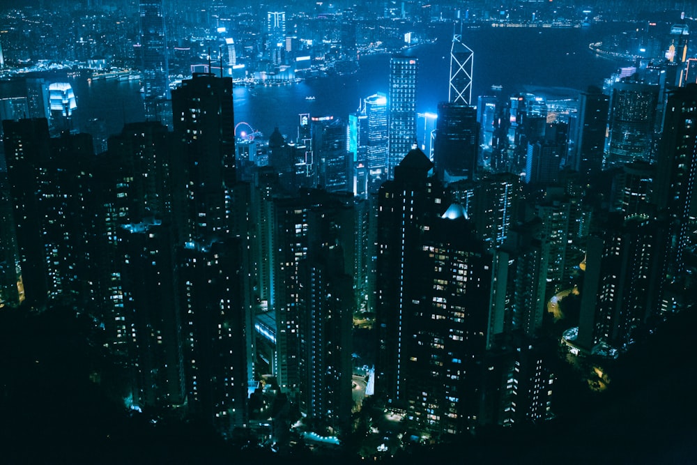 river surrounded with high-rise building during nighttime