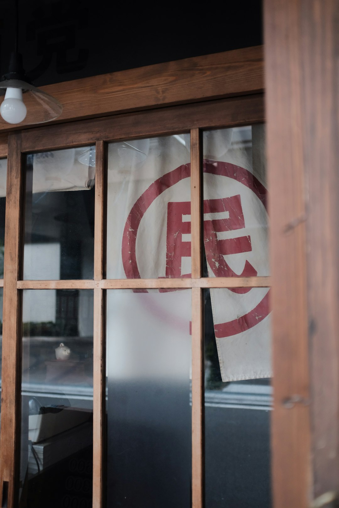 brown wooden framed glass panel window