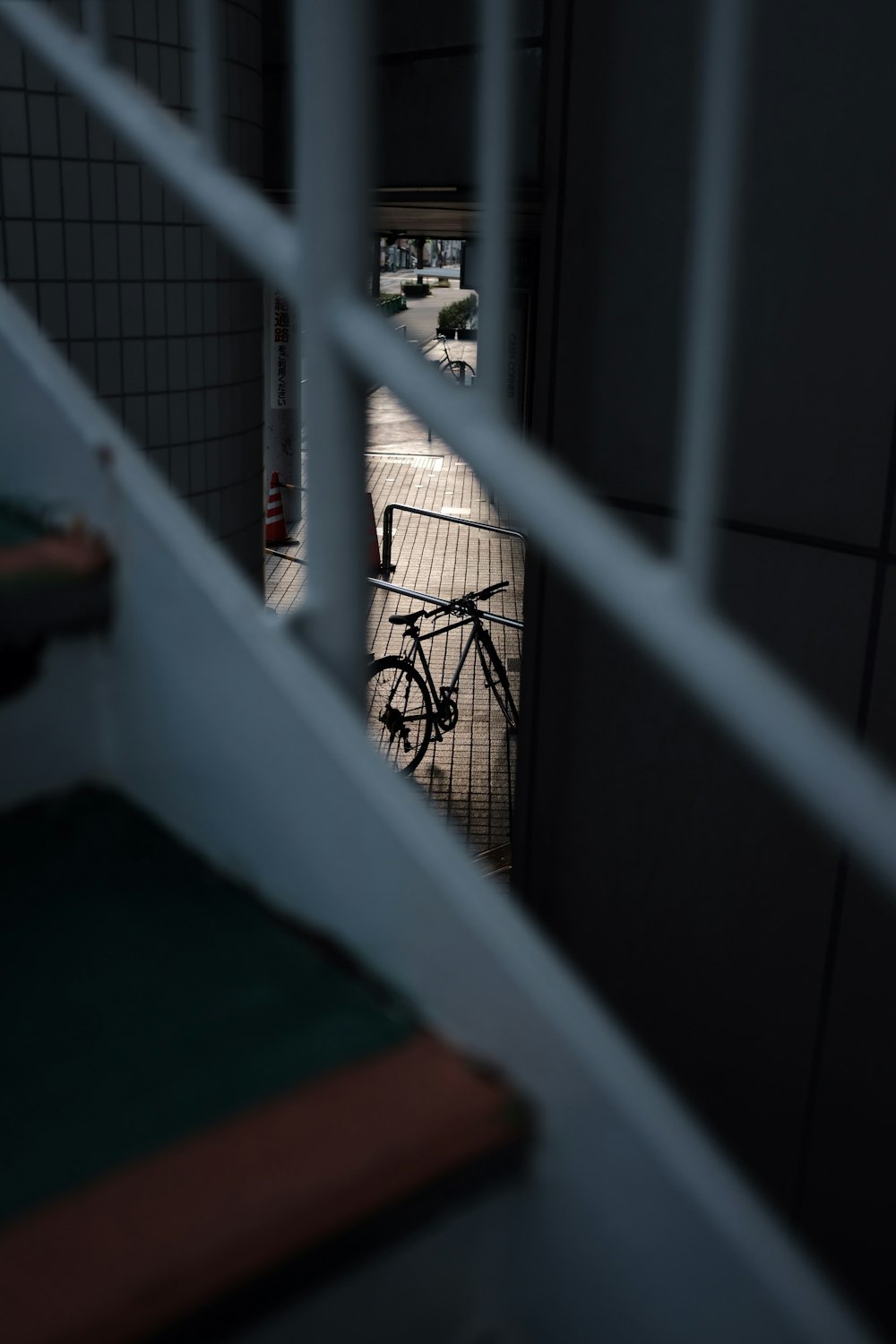 a bike is seen through the bars of a jail cell