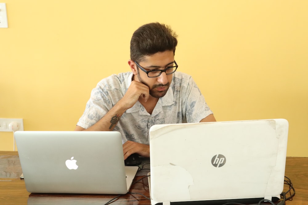 man looking at laptop computer