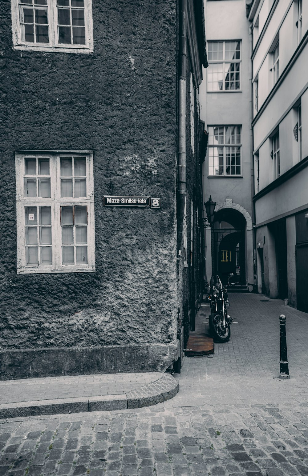 parked motorcycle beside building