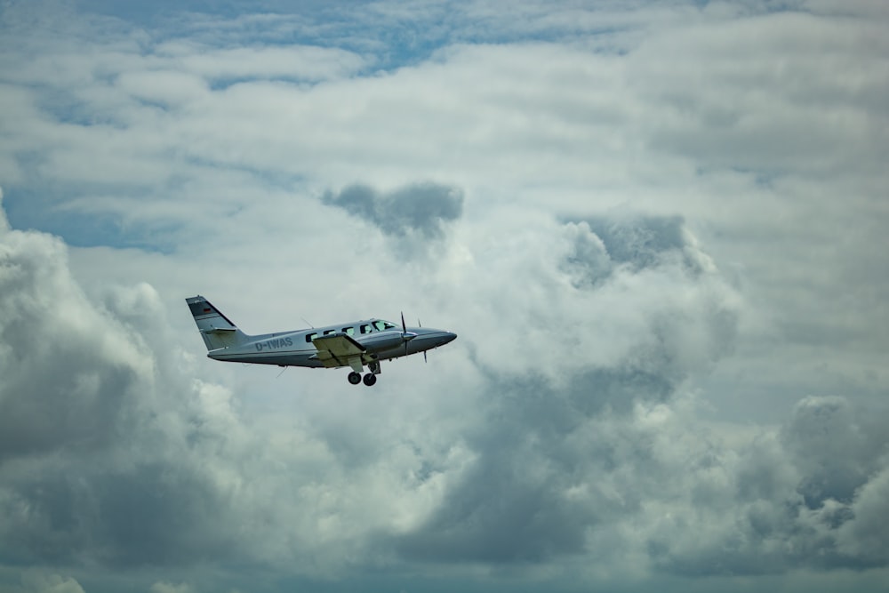 white airplane midair scenery