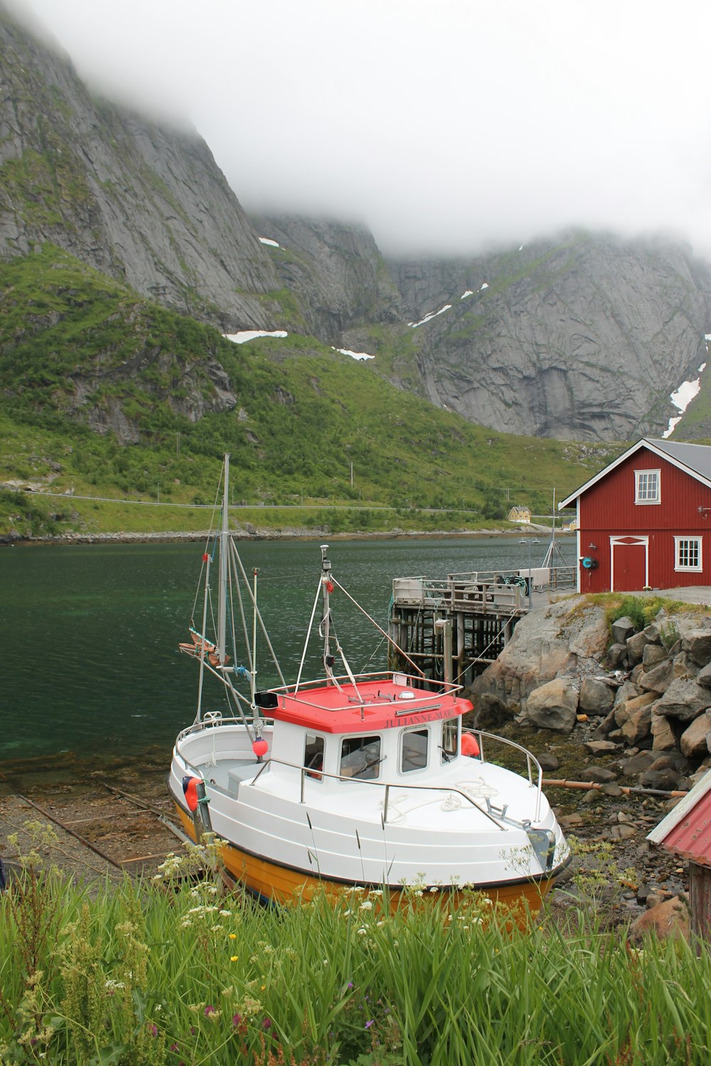 white and red motorboat