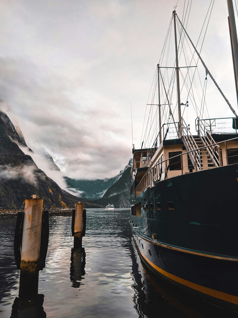 black and yellow ship at a dock