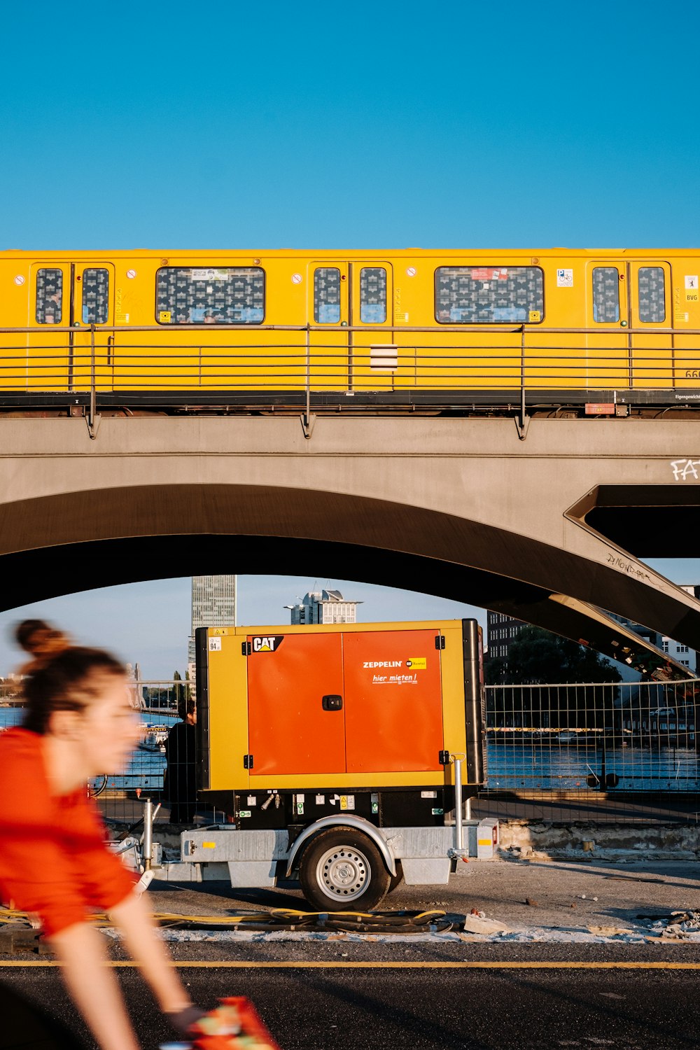 trailer under yellow train