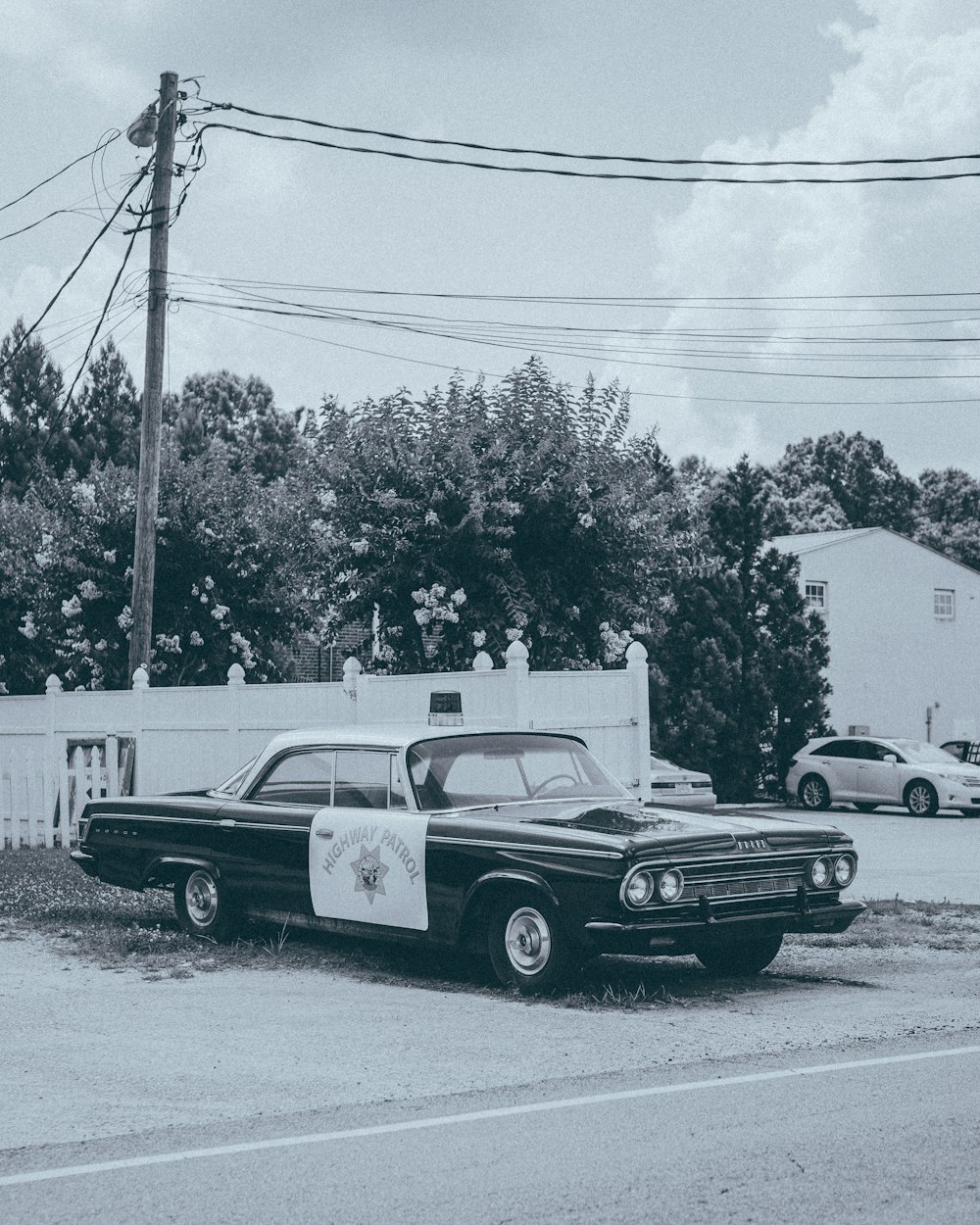 grayscale photo of police car