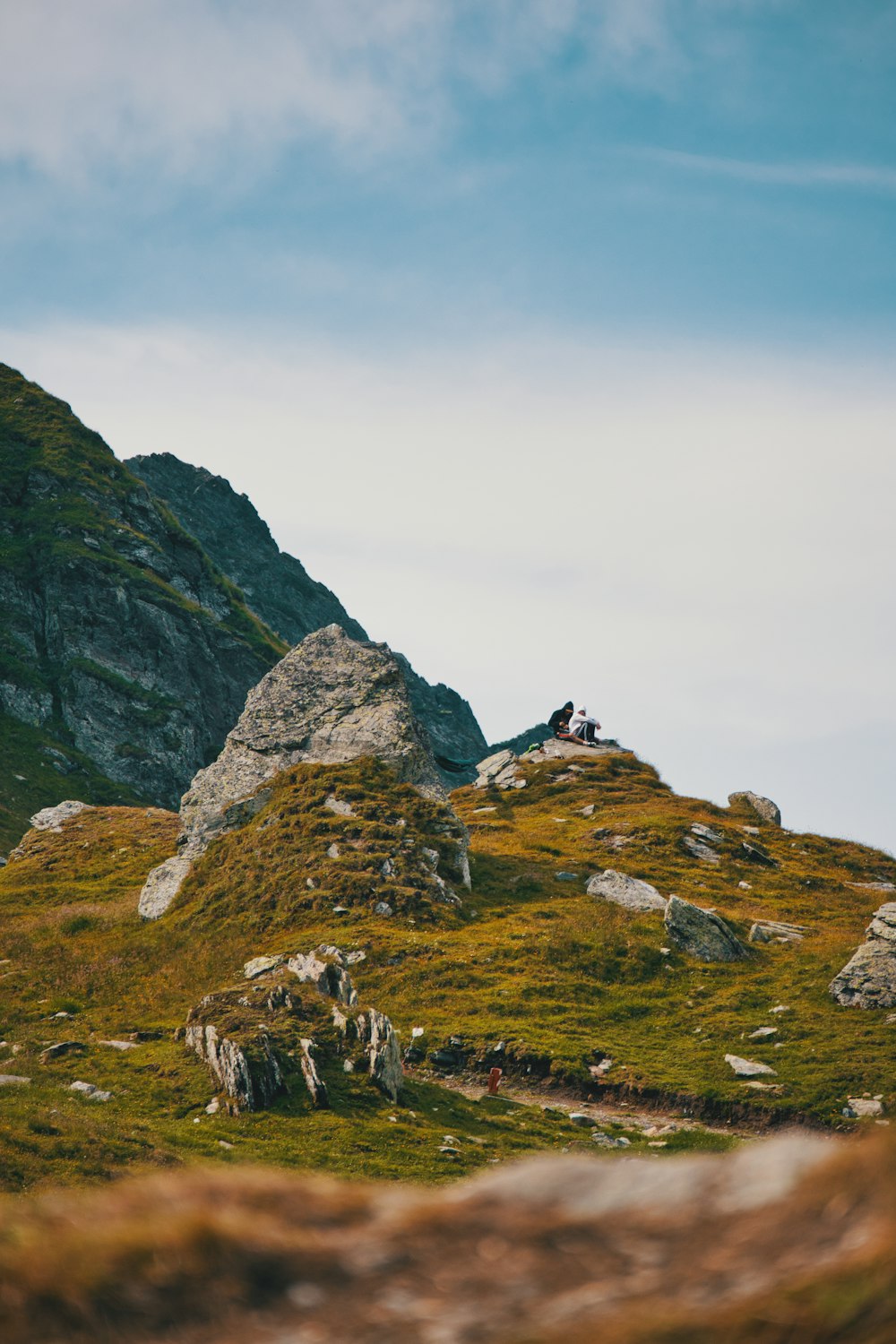 rock formations in hill under cloudy sky