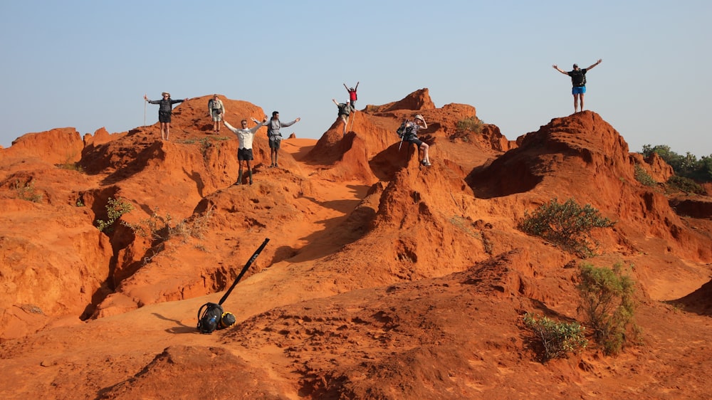 people standing on rocks