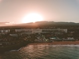 Aerial view of a modern beachfront property in Riviera Maya at sunset.