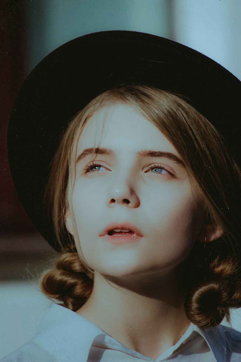 portrait photography of woman wearing black hat