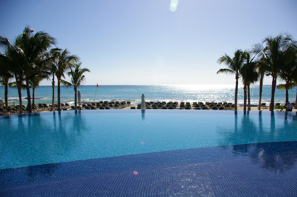 blue infinity pool fronting the sea