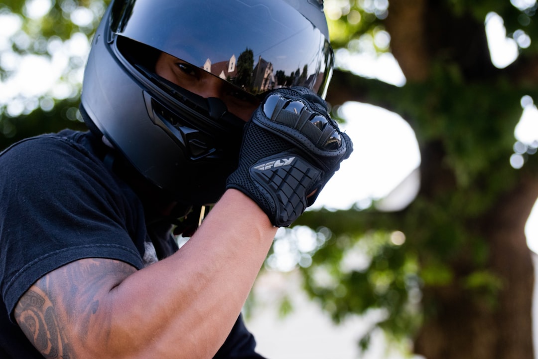 man wearing black helmet and black shirt