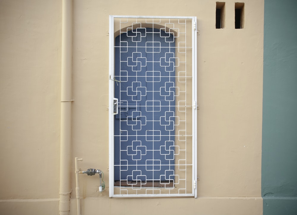 a window with a blue and white pattern on it