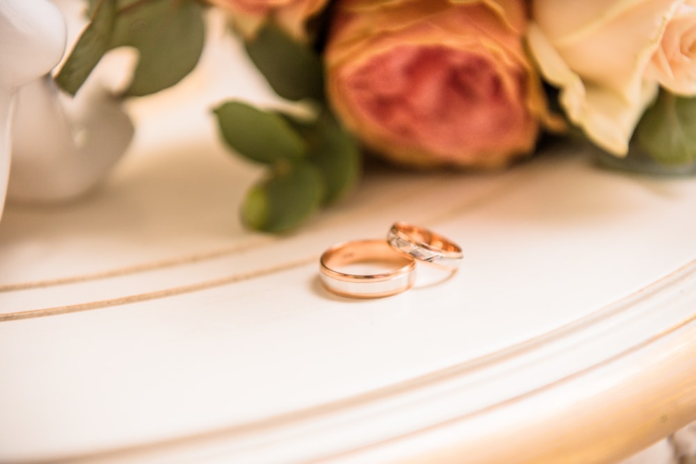 two couple rings on table